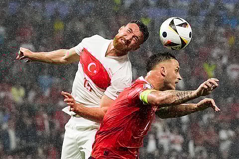 Salih Ozcan and Marko Arnautovic head the ball